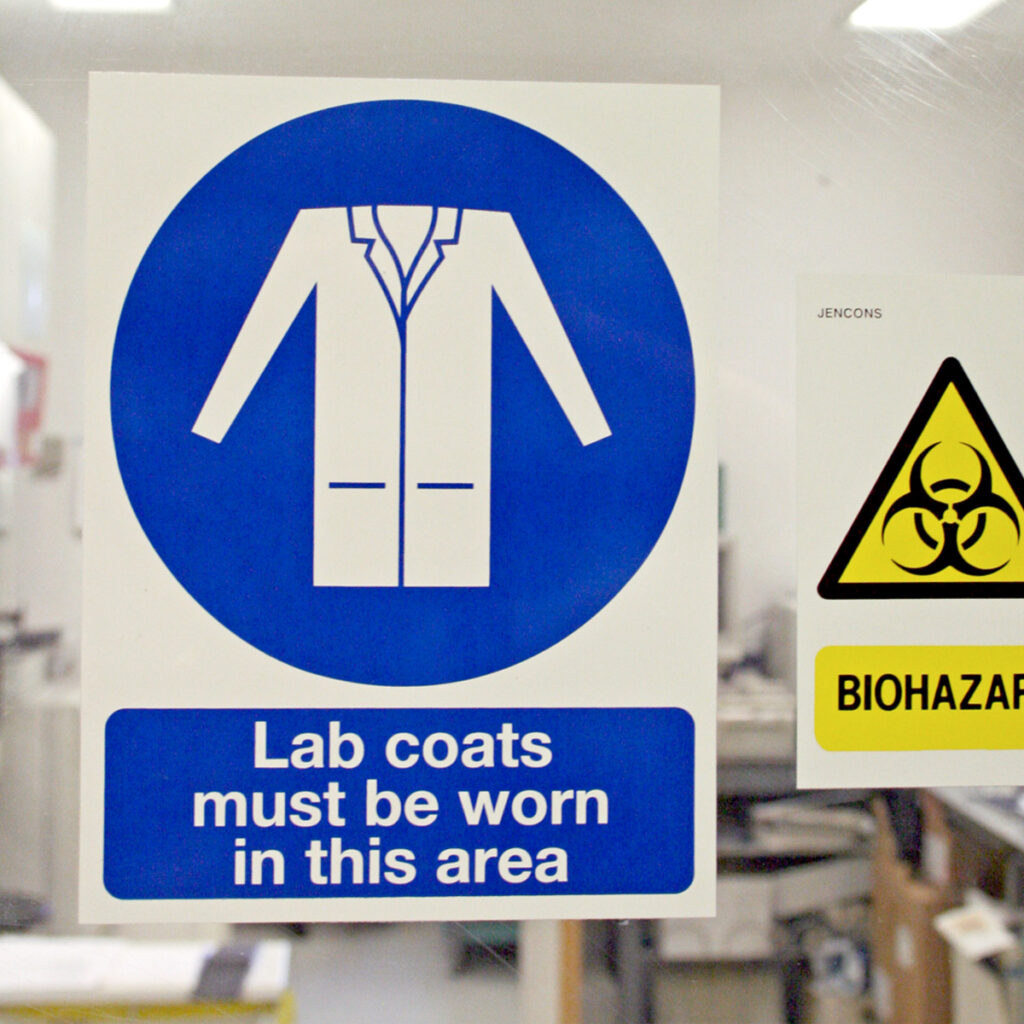 Health and safety signage on entry to a lab